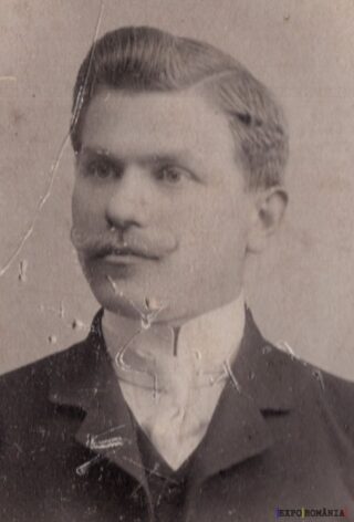 Portret alb-negru al unui bărbat elegant